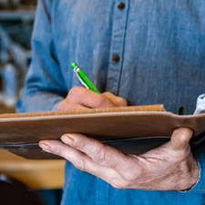 image of a real estate appraiser taking notes during an inspection