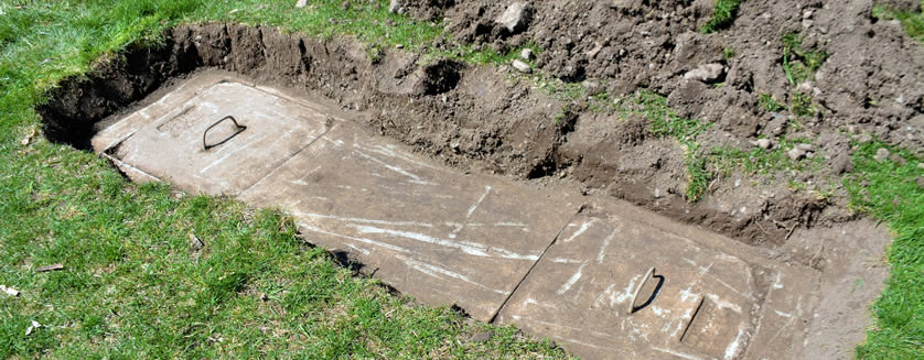image of a septic system being dug out and uncovered
