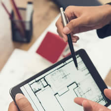 image of a real estate appraiser trainee taking notes with a mentor during an inspection